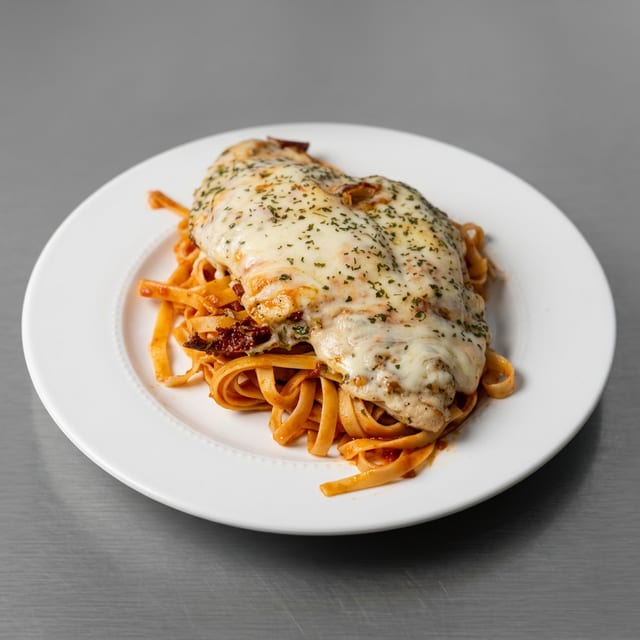 Grilled Chicken Parmesan with Tomato Sauce.